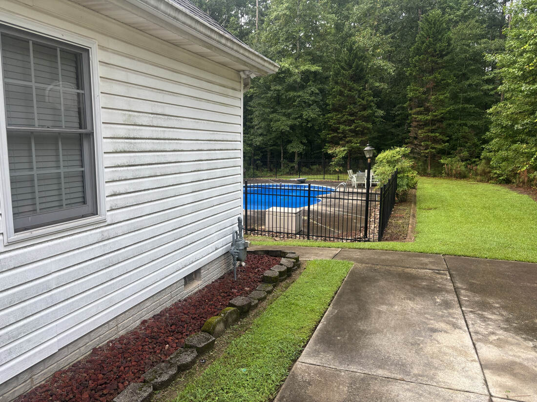 Siding before pressure washing, poolside