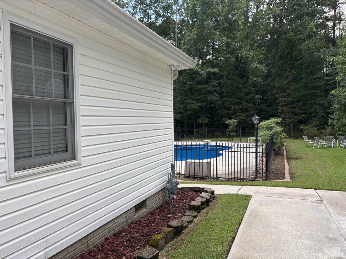 Siding after pressure washing, poolside